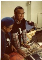 Exhibit - Man Showing Picture 1984