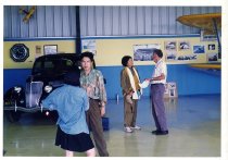 Maggie Gee talking to a man in a museum