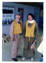 Maggie Gee and a man standing outside of a prop house