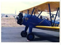 Maggie Gee sitting in the cockpit of a biplane