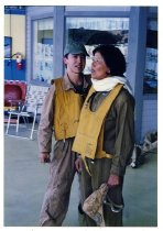 Maggie Gee and a man standing outside of a prop house