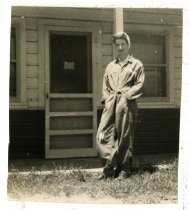 A WASP standing in front of a barracks