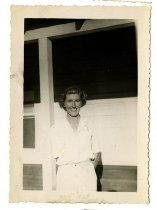 Dorothy Estep standing in front of a barracks