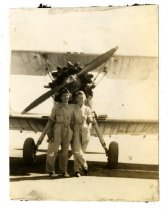 Two WASP in front of a biplane
