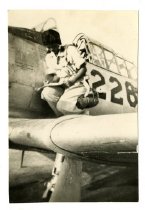 Maggie Gee on the wing of a trainer plane