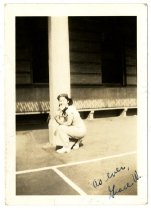 A woman kneeling near a beam
