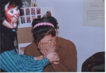 Woman holding face to hands