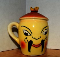 Salt and Pepper shakers with a cartoon sterotype