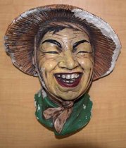 Woman in green with conical hat