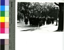 Graduates in Caps and Gowns Walking 1940