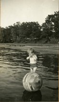 Robert Ross Turner with a beach ball, circa 1932-1933