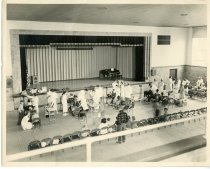Dental students in auditorium with children