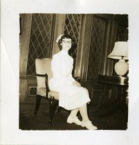 Jackline Myers seated in dental hygiene uniform in white cushioned chair