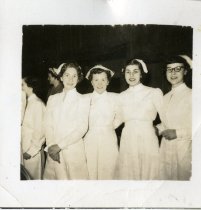 Jackline Myers with three women in dental hygiene uniforms