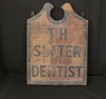 T.H. Slater Dentist wooden sign