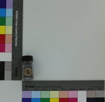 Clear squared glass Stratford Cookson Co. jar with a black cap and black se