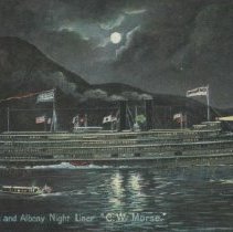 Night view of the Palisades with steamboat C.W. Morse