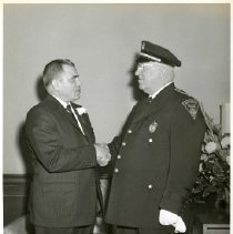 Mayor P. Raymond Sirignano (left) shaking hands with Police Chief William P. McDonald on inauguration day, January 1, 1960