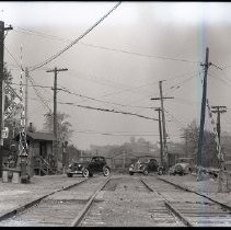 Cars crossing New York Central Putnam Division railroad tracks at Yonkers Avenue - looking northeast from Dunwoodie Station