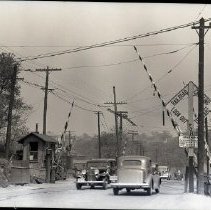 Cars crossing New York Central Putnam Division railroad tracks at Yonkers Avenue - looking east