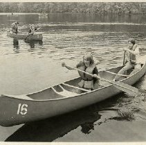 Ellen Klingenberg and Louise Gillette canoeing at Mountain Lakes Camp
