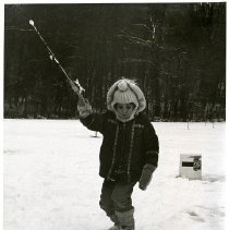 A child ice-fishing at Mountain Lake Camp