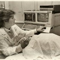 Barbara Parkinson with patient in vascular lab, United Hospital