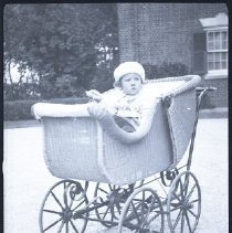 Unidentified Iselin child in baby carriage at Breakwater House