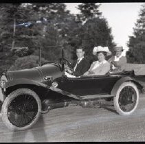 Three unidentified members of the Iselin family in an automobile at Breakwater House