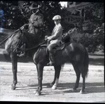 Members of the Iselin family riding horses