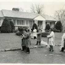 Members of the Westchester Tax Commission outside a house