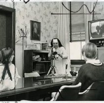 Sister Geraldine of Villa Loretto operating a closed circuit television camera