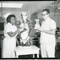 Emma Cralle and John Leopz, Jr., in the laboratory of the United Hospital School of Nursing