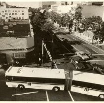 Articulated bus making a left turn from Mamaroneck Avenue on to Martine Avenue - looking north