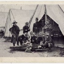 Red Cross Corps at work over injured comrade, State Camp (Camp Smith)