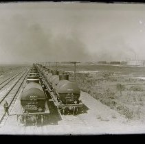 Chicago.Sinclair Refinery oil tank cars. Oil storage bldgs in background.