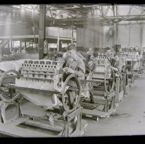 Assembling motor (model G-6) for Curtiss 1920 Oriole airplane.
