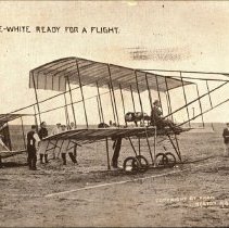 Real photo postcard: aviator Claude Grahame-White in airplane on field, ca.