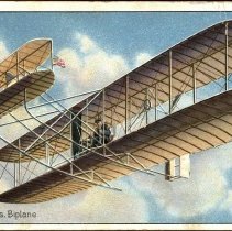 Embossed color postcard showing Wright Brothers biplane
