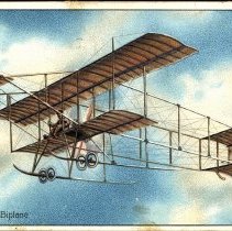 Embossed color postcard showing Farman biplane