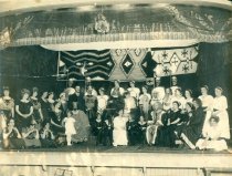 Play cast on stage in costume