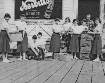 Girl Scouts gathering pop bottles