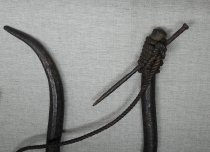 Iron hook with nail lashed on