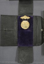 1922 Southeast Alaska County Fair medal and holder