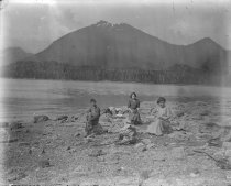 Two women and young man on beach