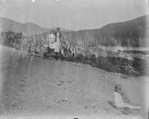 Man, woman, and four kids on the beach