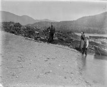 Man, woman, and young boy on beach