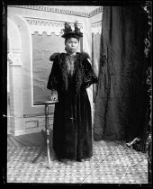 Woman with hat and half cape