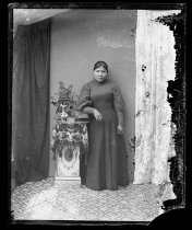 Woman with books on pedestal