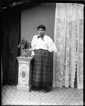 Woman in plaid in studio